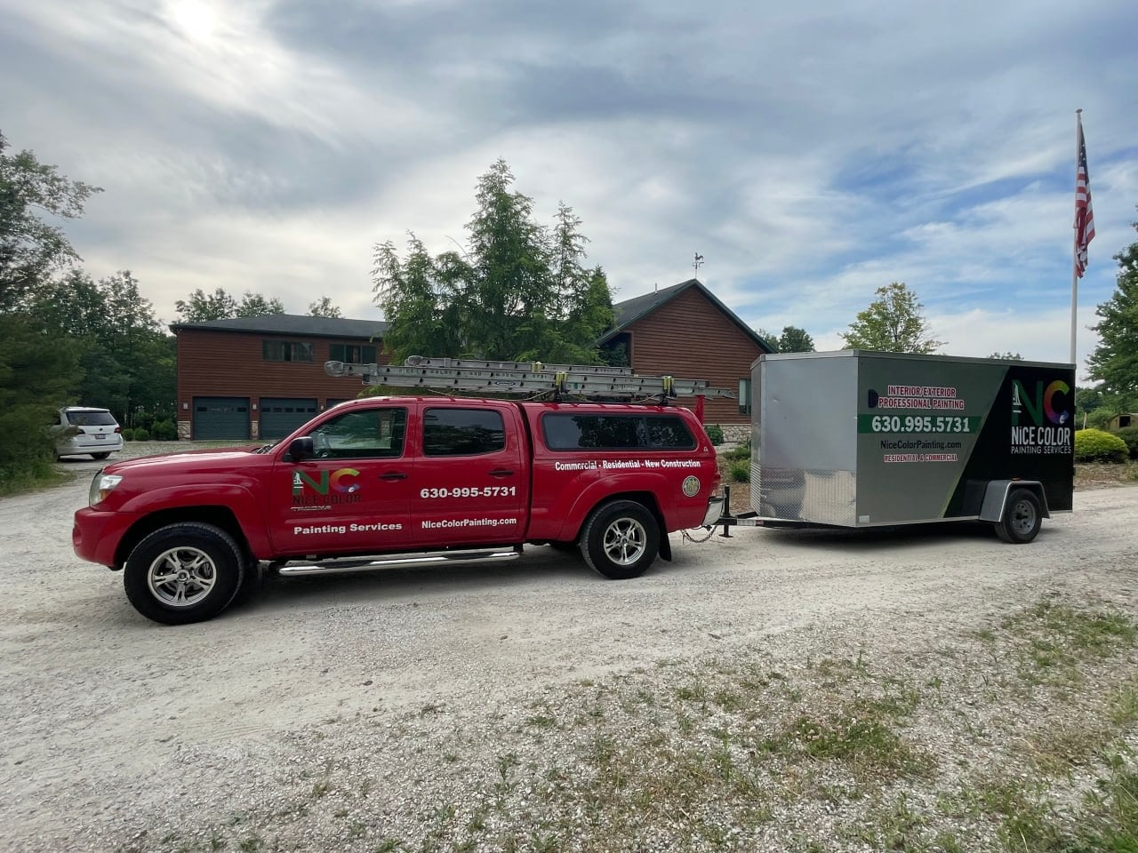Nice Color Painting branded red work truck and enclosed trailer parked at a residential project site, with ladder rack and painting supplies visible